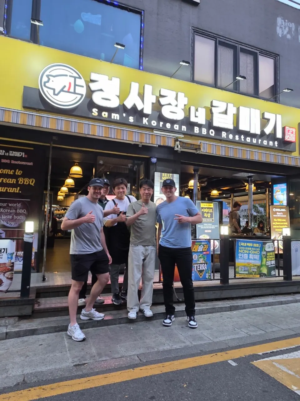 Guests and staff outside the entrance of Sam's Korean BBQ